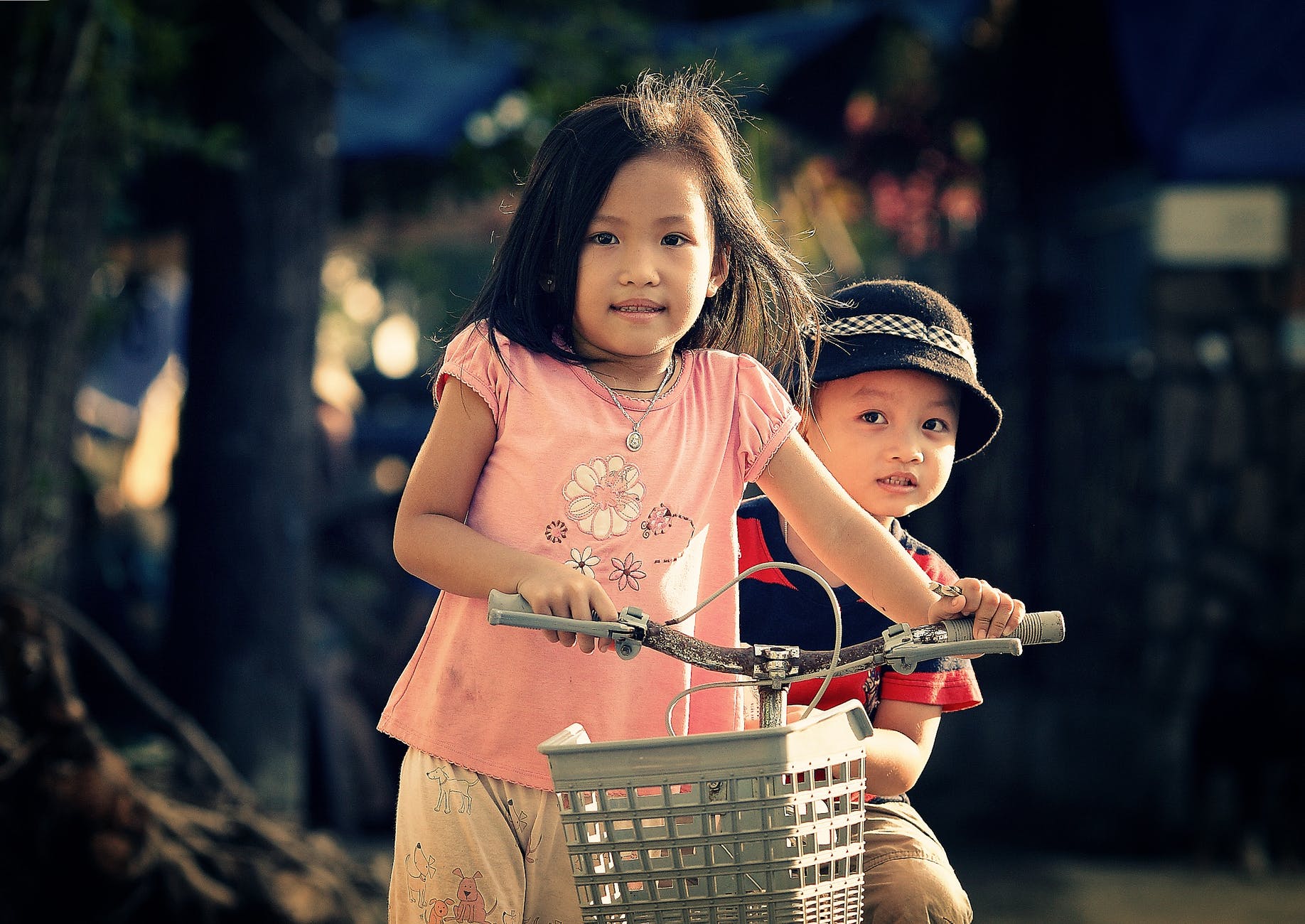 children riding bicycle